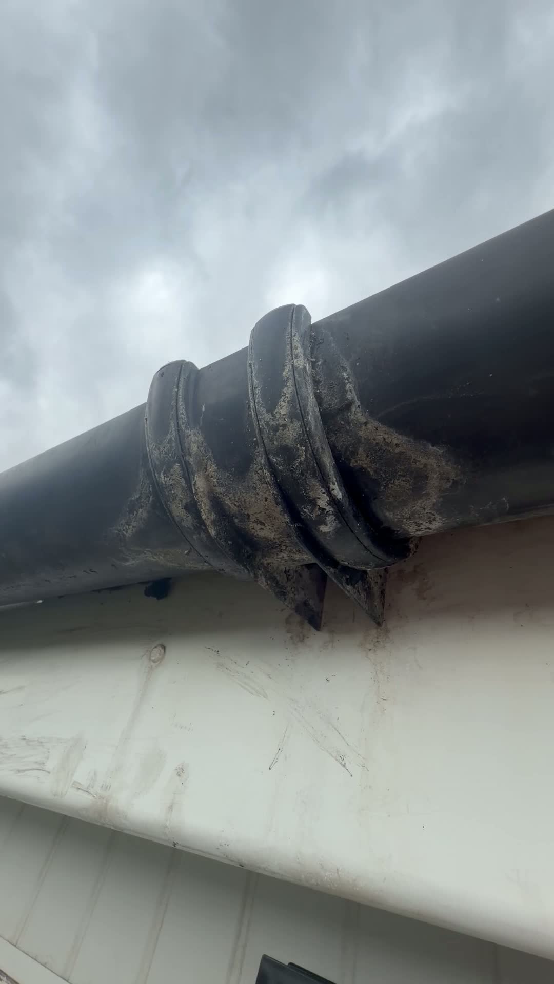 Weathered gutter joint photographed on a Suds & Spruce job